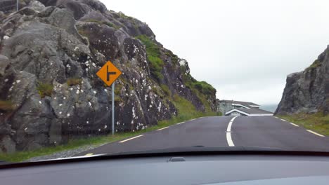 Dashboard-driving-Ireland-rural-road-perspective-view-from-windshield