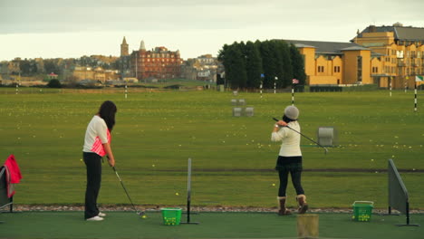 Women-practicing-golf-for-the-first-time-at-St-Andrews-course
