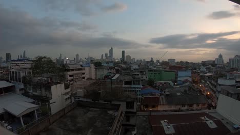 Day-to-Night-Time-lapse-over-the-rooftops-of-Bangkok,-Thailand