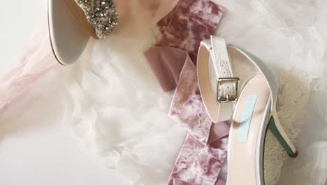 Overhead-shot-of-wedding-ring,-shoes-and-other