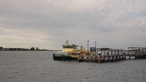 Ferry-leaving-berth-on-Newcastle-harbour-at-dusk