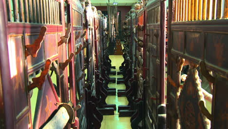 Row-of-antique-sword-racks-in-museum-of-ancient-Chinese-weaponry