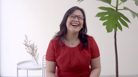 Indonesian-middle-aged-lady-laughing-during-an-interview-set