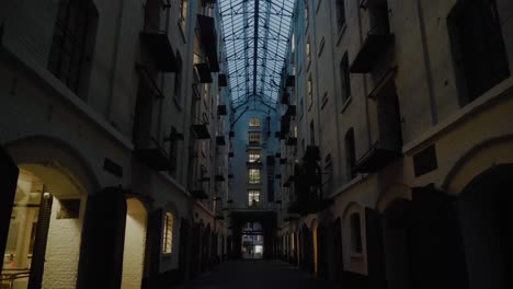 Dark-Mysterious-Alleyway,-Back-of-Houses,-Glass-Roof,-Old-Town,-Dusk
