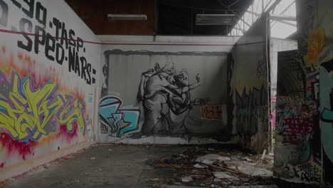 Urban-Exploration-Of-Warehouse-Room-With-Graffiti-On-Walls