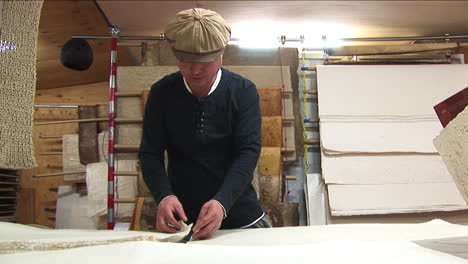 Traditional-Papermaking-in-China,-Worker-Moving-Handmade-Paper-Sheet