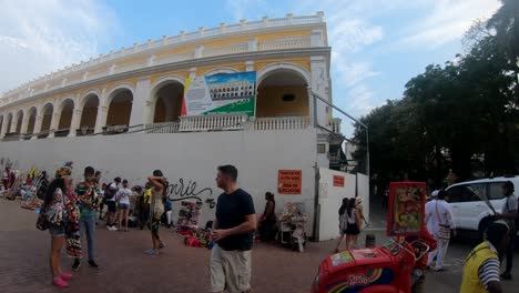 Tourists-are-standing-and-walking-by-the-old-town-of-Cartagena-de-Indias,-Colombia