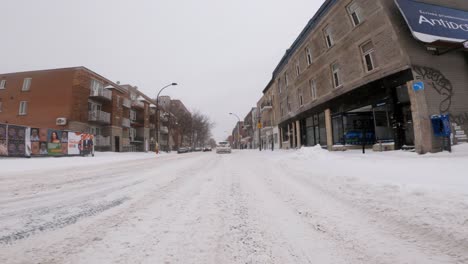 POV-Driving-Through-Winter-Snow-Covered-Road-In-Hochelaga-Neighbourhood-During-Winter-In-January-2002