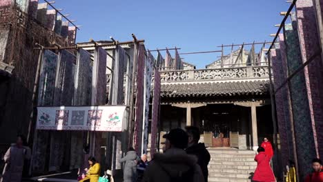 Gubei-Water-Town-people-admiring-textile-hanging-sun-drying