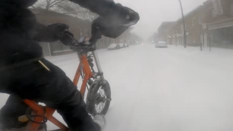 Side-Angle-POV-Of-Courier-On-Radburro-Riding-Through-Snowstorm-In-Downtown-Montreal