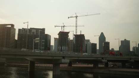 Traffic-Crossing-Bridge-With-Construction-Crane-Skyline-In-The-Background-In-Montreal