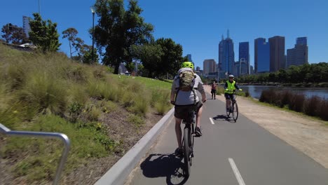 Cycling-along-Yarra-river-in-Melbourne-heading-into-the-city
