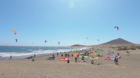 Kitesurfing-At-The-Beach-Of-Playa-de-El-Medano-On-A-Sunny-Day-In-Summer-At-Tenerife,-Spain