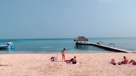 Tourists-are-enjoying-the-beach-of-a-paradisiac-island-with-clear-and-turquoise-ocean-water