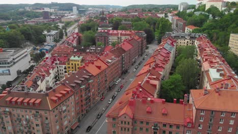 Aerial-video-of-beautiful-apartment-buildnings-near-Korsvagen-in-the-central-part-of-Gothenburg,-Sweden,-with-some-nice-green-trees-and-bushes-around-them