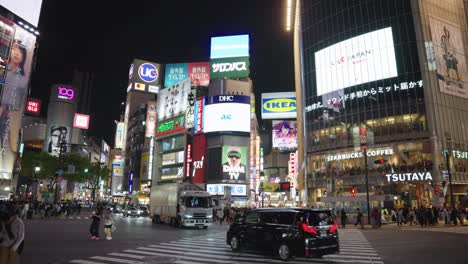 Neon-Tokyo-Nightlife,-Busy-Scramble-Crossing-and-Shopping-Malls