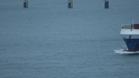 Container-Ship-Sailing-Across-The-Sea-Near-Maasvlakte-In-Rotterdam,-Netherlands