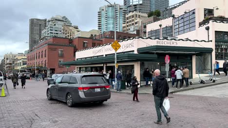People-And-Traffic-Going-Past-Beecher's-Handmade-Cheese-Store-in-Seattle