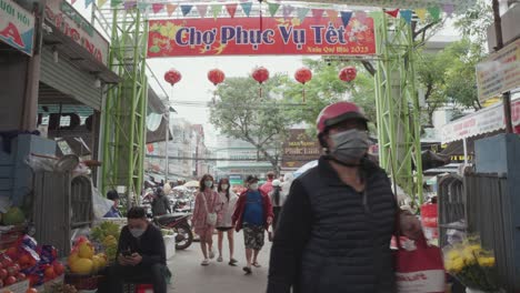 Local-vendors-and-traditional-stalls-sell-fresh-fruits,-vegetables,-and-clothes-at-busy-and-colorful-Con-Market-in-Danang,-Vietnam