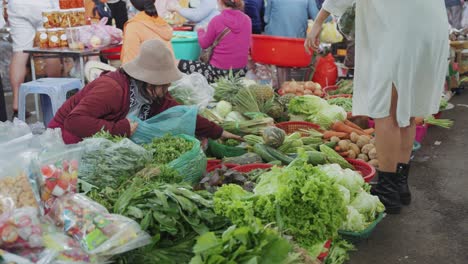 Local-vendors-and-traditional-stalls-selling-fresh-fruits-and-vegetables,-at-busy-and-colorful-Con-Market-in-Danang,-Vietnam-in-Asia