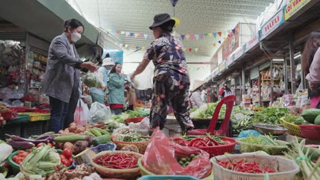 Local-vendors-and-traditional-stalls-sell-fresh-fruits,-and-vegetables,-textiles,-and-clothes-at-the-famous,-busy-and-colorful-Con-Market-in-Danang,-Vietnam-in-Asia