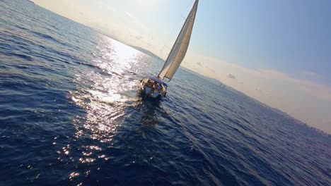 FPV-aerial-flying-toward-a-sailing-yacht-on-a-scenic-evening-on-the-Mediterranean-Sea