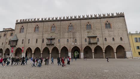 People-On-The-Frontyard-Of-Ducale-Palace-In-Piazza-Sordello,-Mantova-Mantua,-Italy