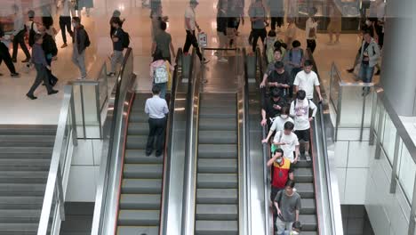 Chinese-shoppers-ride-on-automatic-moving-escalators-at-a-high-end-shopping-mall-in-Hong-Kong