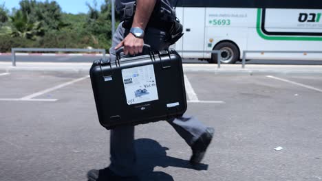 Professional-drone-pilot-walking-with-a-drone-suitcase