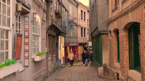 People-On-The-Narrow-Cobblestoned-Street-Of-Honfleur-Old-Town-In-France