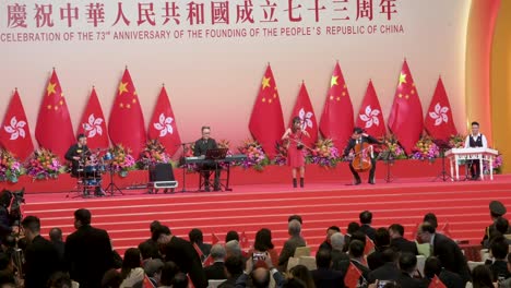 An-entertainment-band-plays-in-front-of-government-officials-and-Pro-China-guests-they-attend-a-ceremony-celebrating-China's-National-Day-and-anniversary-on-October-1st