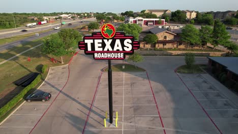 Editorial-Aerial-footage-of-the-Texas-Roadhouse-sign-in-Denton-Texas-located-at-2817-S-Interstate-35,-Denton,-TX-76205