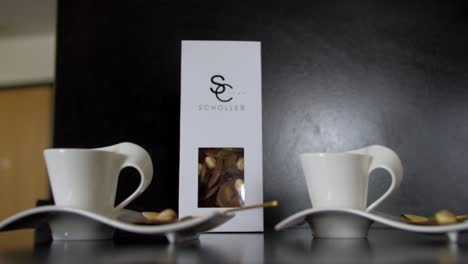 Slow-closing-shot-of-coffee-mugs-sitting-prepared-on-a-hotel-counter