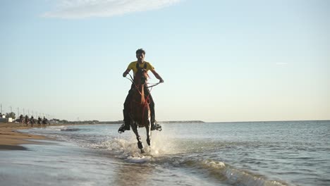 Man-riding-a-horse-on-the-beach