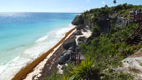 The-view-from-the-lookout-on-top-of-the-cliff-at-the-mayan-archaeological-site-of-Tulum,-Quitana-Roo,-Mexico