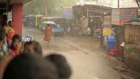People-stuck-in-rain,-lonely-woman-walking-in-rain-with-umbrella,-woman-monsoon-season,-slow-motion-shot-of-rain-drops