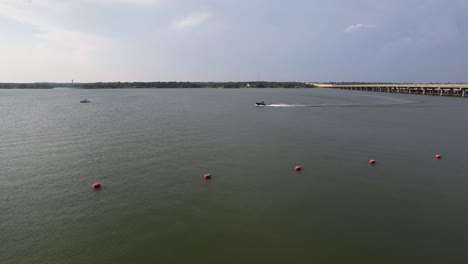 This-is-an-aerial-video-of-a-boat-with-a-skier-on-Lake-Lewisville-near-Copperas-Branch-Park