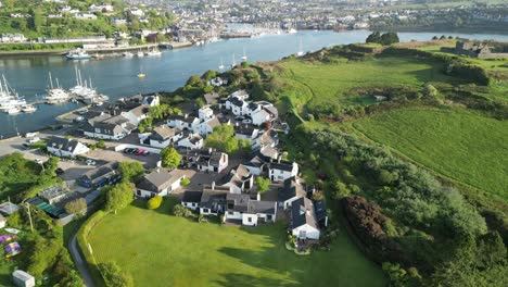 Aerial-footage-on-a-sunny-morning-over-holiday-village-Castlepark-marina-and-river-Bandon-over-to-Kinsale-harbour-and-town