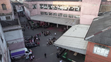 Aerial-view-around-people-at-the-Carlos-Capslock-festival-area,-in-Fabriketa,-Sao-Paulo,-Brazil