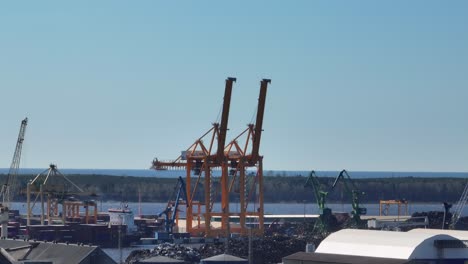 Two-big-yellow-cranes-that-unload-or-load-sea-containers-from-ships-at-the-port-of-Klaipeda
