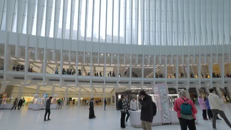 Tilt-down-view-from-ceiling-to-floor-of-Oculus-Mall,-World-Trade-Center-Path-station,-New-York