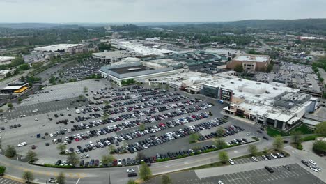 Rotational-aerial-drone-shot-of-major-outlet-stores-including-Primark-and-Dick's-Sporting-Goods