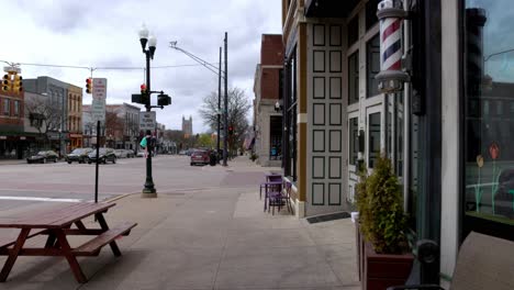 Downtown-Howell,-Michigan-on-the-sidewalk-walking-forward