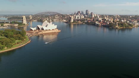 Sydney,-New-South-Wales,-Australia---25-December-2021:-Beautiful-aerial-view-of-the-Sydney-Opera-House-the-The-Sydney-Harbour-Bridge-and-the-buildings-on-the-north-side-of-the-CBD