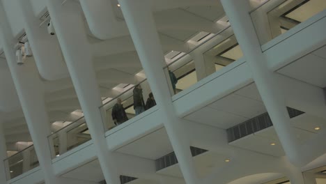 Shoppers-walking-on-elevated-floor-of-Oculus-Mall,-World-Trade-Center-Path-station,-New-York-in-USA