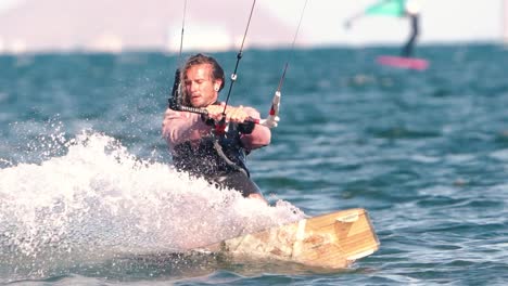 Los-Alcazares,-Spain,-May-3,-2023:-Sportsman-practicing-kite-surf-sport-at-the-beach-on-a-windy-day-at-the-Spanish-coasts