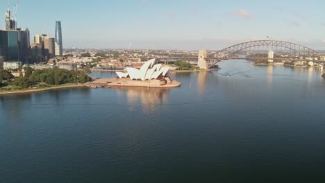 Sydney,-New-South-Wales,-Australia---25-December-2021:-Aerial-V-over-Sydney-Harbour-with-the-Sydney-Opera-House-the-Sydney-Harbour-Bridge-and-part-of-the-CBD-in-the-background