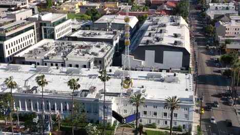 Aerial-view-circling-KTLA-5-channel-news-tv-and-radio-broadcasting-station-studios-and-tower,-Los-Angeles,-California