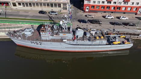The-military-ship-Suduvis,-which-served-in-its-time,-is-now-standing-in-the-Danes-river-and-has-been-turned-into-a-museum