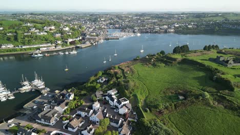 Aerial-view-over-holiday-village-Castlepark-marina,-river-Bandon-and-Kinsale-harbour-and-town-with-James-fort-in-the-corner